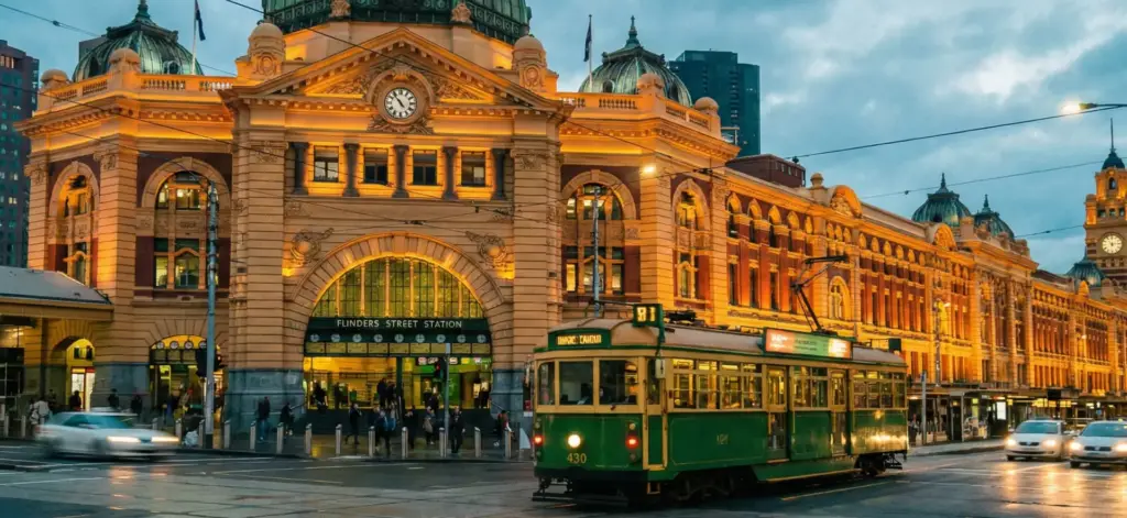Flinders Street Station and heritage tram in Melbourne at dusk