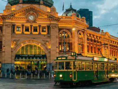 Flinders Street Station and heritage tram in Melbourne at dusk